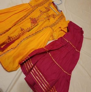 It's beautiful dress in orange and pink